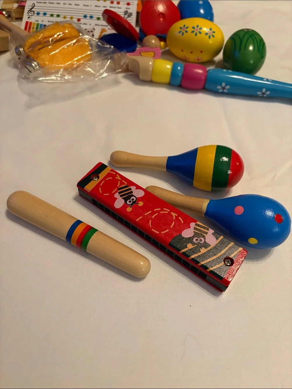 Multicolor Kids Wooden Musical Instrument Set with backpack.